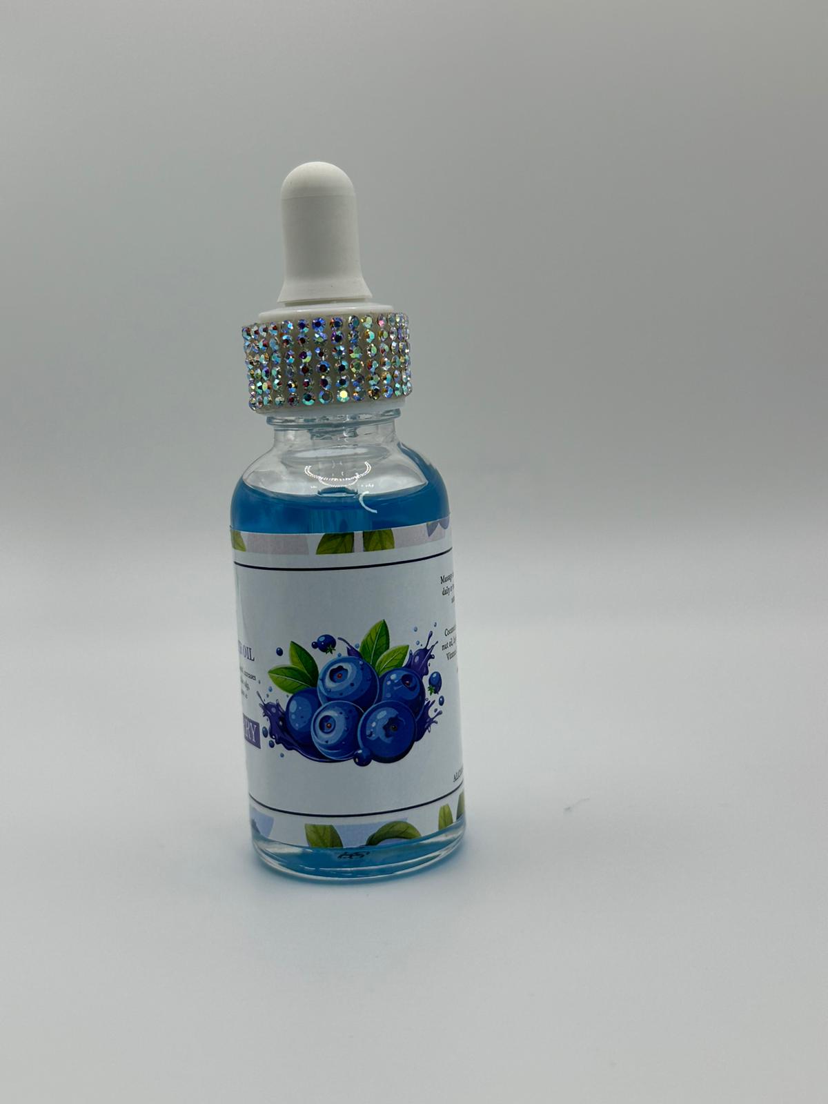 Bottle with dropper labeled 'Blueberry' on a gray background