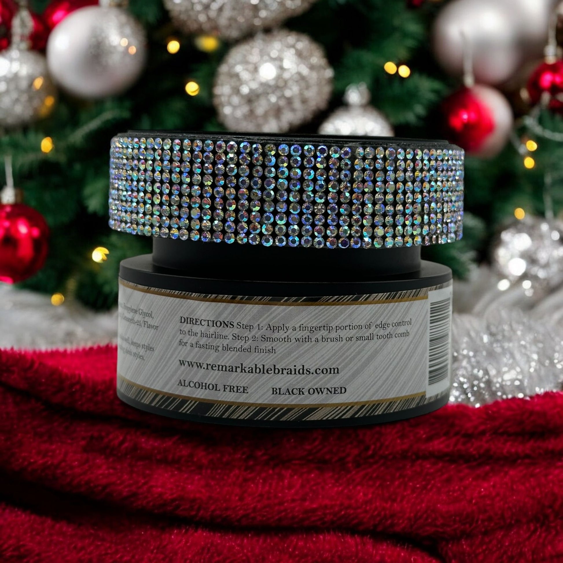 Remarkable Braids Edge Control Max Hold jar with rhinestone lid against warm golden bokeh lights