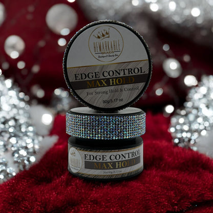 Edge Control Max Hold gel by Remarkable Braids with rhinestone lid in snowy holiday setting with twinkling lights